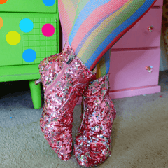 Model wearing rainbow coloured fishnets