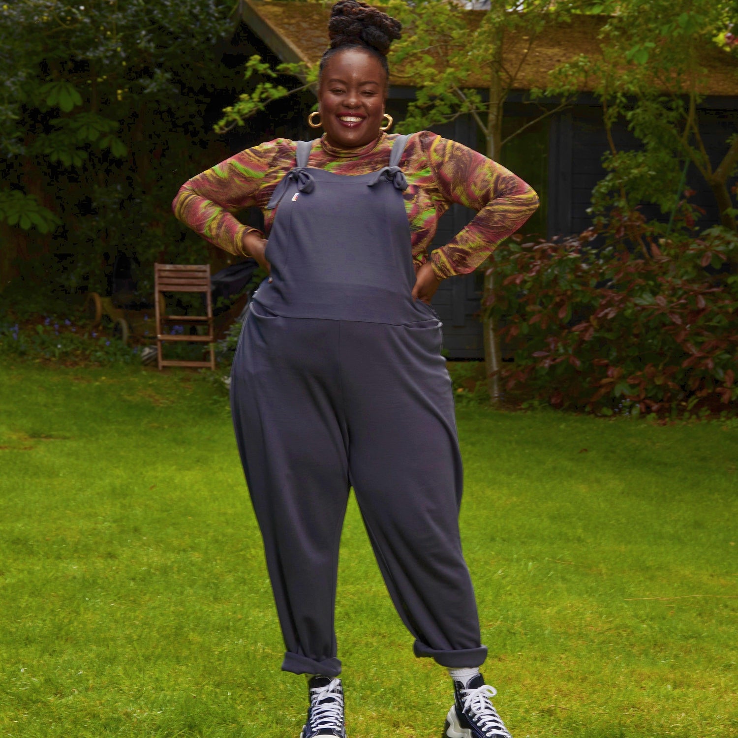 Woman wearing slate grey dungarees