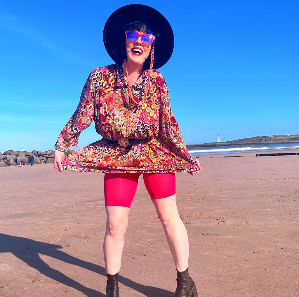 Woman wearing pomegranate chub rub shorts